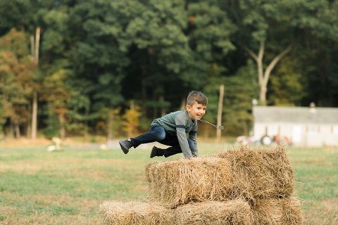 Fall is in full swing here in NJ, my first Fall Family session with Anna and Adam at their Farm House in Hackettstown NJ. Anna and Adam recently purchased their dream farm house on a 4 acres of land. This family of four now has chickens, ducks, birds, cats, a dog, sheep and plans to add many more to the list in the future. I had the honor of visiting Anna and Adam and their two beautiful children at their Farm the other day. I got much need vitamin D walking around the property, enjoying the foliage, running around with their kids and meeting all the farm animals. I sincerely enjoy photographing families now because there are no dull moments with kids, every moment is perfect! Fall family session at Anna and Adam’s Farm at Hackettstown NJ photographed by Karis from HeyKaris. 