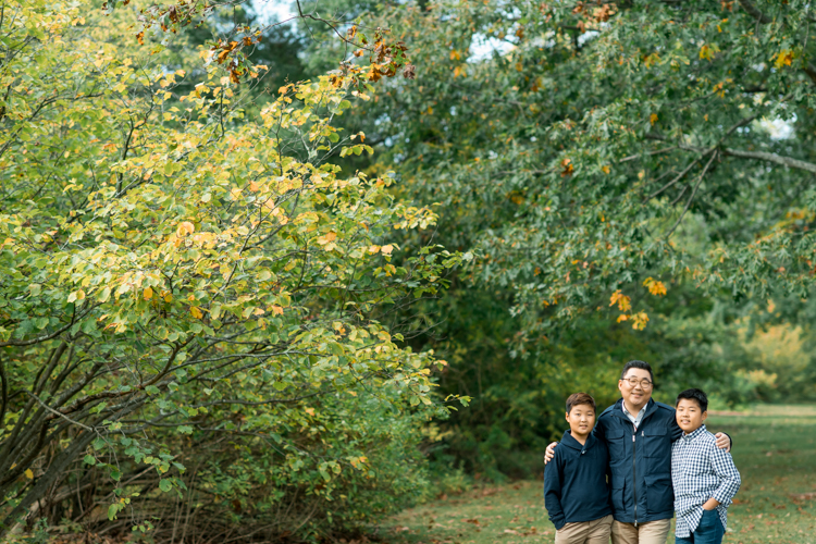 Esther and Thomas’ Fall family session at NJ Botanical Garden with three of their older children were so much to photograph since older kids tend to follow direction better. But I can not do cute little poses that I do with younger children. I thought to myself what would Wes Anderson do? Something more abstract and something fun. Bigger and older kids needed big actions and something not cheesy. Photographing older kids were bit challenging at first but I think we all had some fun and got some good photos for Esther and Thomas’ family. Esther and Thomas’ fall family session at NJ Botanical Garden photographed by Karis from Hey Karis. Photograph is like freezing time, motion in print, movie turned into a book.