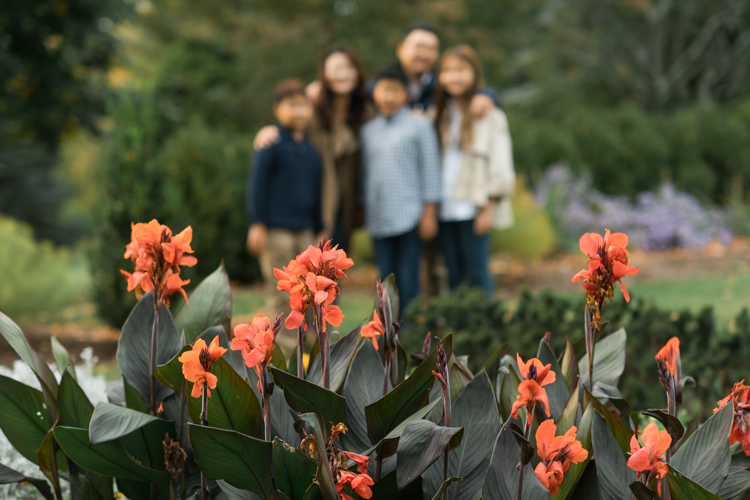 Esther and Thomas’ Fall family session at NJ Botanical Garden with three of their older children were so much to photograph since older kids tend to follow direction better. But I can not do cute little poses that I do with younger children. I thought to myself what would Wes Anderson do? Something more abstract and something fun. Bigger and older kids needed big actions and something not cheesy. Photographing older kids were bit challenging at first but I think we all had some fun and got some good photos for Esther and Thomas’ family. Esther and Thomas’ fall family session at NJ Botanical Garden photographed by Karis from Hey Karis. Photograph is like freezing time, motion in print, movie turned into a book.