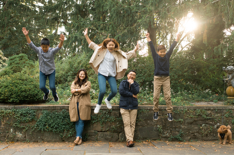 Esther and Thomas’ Fall family session at NJ Botanical Garden with three of their older children were so much to photograph since older kids tend to follow direction better. But I can not do cute little poses that I do with younger children. I thought to myself what would Wes Anderson do? Something more abstract and something fun. Bigger and older kids needed big actions and something not cheesy. Photographing older kids were bit challenging at first but I think we all had some fun and got some good photos for Esther and Thomas’ family. Esther and Thomas’ fall family session at NJ Botanical Garden photographed by Karis from Hey Karis. Photograph is like freezing time, motion in print, movie turned into a book.
