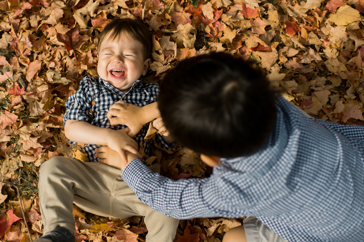 Most perfect, magical time of the year truly is Fall. Everything suddenly became golden, lovely, beautiful and good. Every sunrise and sunset is so great. We enjoyed full Fall weather with Jackie and Rob during their Fall family session at NJ Botanical Garden. Jackie and I went to Leonia High school together and it’s been over twenty years since we last met, nothing seemed different except now with our own kids and a husband. It was so great seeing old friend and her family, their shared smiles, love. A family’s chemistry is so warm, love so big and true. I sincerely love photographing family photos, I am so glad I am the person to capture this memory for them. Photograph is like freezing time, motion in print, movie turned into a book. Fall family session at NJ Botanical Garden with Jackie and Rob captured by Karis from Hey Karis.
