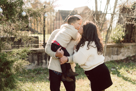 Brooke reached out to me for holiday family session and she had plans, props and we were all looking forward to Brooke and Mike’s holiday family session with their two kids Grace and Tommy at Historic Richmond Town in Staten Island NY. Brooke and Mike are from Staten Island and they did not live too far from Historic Richmond Town and they decorate the whole town pretty festive so we decide to meet there. But like all plans Brooke’s big hope for her very first professional photoshoot didn’t go as she planed. Her two kids Grace and Tommy were not having it. As soon as they got to the parking lot Tommy fell asleep. Grace was shy and scared to have her photos taken by a stranger photographer me. But we tried and got some good cute photos, and some not so cute and grumpy photos as well. Brooke, Mike, Grace and Tommy’s Historic Richmond Town Staten Island Holiday Family session documented and  photographed by Karis from Hey Karis. Photograph is like freezing time, motion in print, movie turned into a book. Now booking 2021 and 2022 weddings.