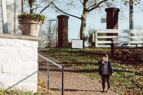 Brooke reached out to me for holiday family session and she had plans, props and we were all looking forward to Brooke and Mike’s holiday family session with their two kids Grace and Tommy at Historic Richmond Town in Staten Island NY. Brooke and Mike are from Staten Island and they did not live too far from Historic Richmond Town and they decorate the whole town pretty festive so we decide to meet there. But like all plans Brooke’s big hope for her very first professional photoshoot didn’t go as she planed. Her two kids Grace and Tommy were not having it. As soon as they got to the parking lot Tommy fell asleep. Grace was shy and scared to have her photos taken by a stranger photographer me. But we tried and got some good cute photos, and some not so cute and grumpy photos as well. Brooke, Mike, Grace and Tommy’s Historic Richmond Town Staten Island Holiday Family session documented and  photographed by Karis from Hey Karis. Photograph is like freezing time, motion in print, movie turned into a book. Now booking 2021 and 2022 weddings.