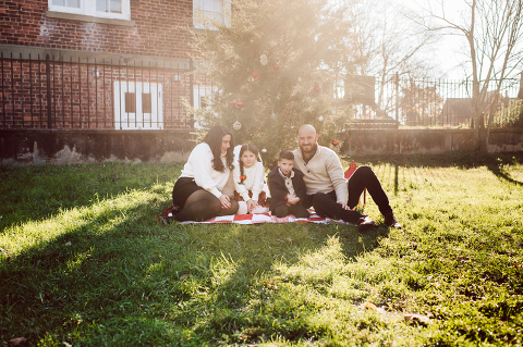 Brooke reached out to me for holiday family session and she had plans, props and we were all looking forward to Brooke and Mike’s holiday family session with their two kids Grace and Tommy at Historic Richmond Town in Staten Island NY. Brooke and Mike are from Staten Island and they did not live too far from Historic Richmond Town and they decorate the whole town pretty festive so we decide to meet there. But like all plans Brooke’s big hope for her very first professional photoshoot didn’t go as she planed. Her two kids Grace and Tommy were not having it. As soon as they got to the parking lot Tommy fell asleep. Grace was shy and scared to have her photos taken by a stranger photographer me. But we tried and got some good cute photos, and some not so cute and grumpy photos as well. Brooke, Mike, Grace and Tommy’s Historic Richmond Town Staten Island Holiday Family session documented and  photographed by Karis from Hey Karis. Photograph is like freezing time, motion in print, movie turned into a book. Now booking 2021 and 2022 weddings.