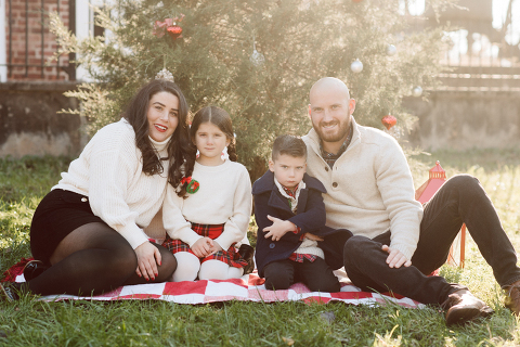 Brooke reached out to me for holiday family session and she had plans, props and we were all looking forward to Brooke and Mike’s holiday family session with their two kids Grace and Tommy at Historic Richmond Town in Staten Island NY. Brooke and Mike are from Staten Island and they did not live too far from Historic Richmond Town and they decorate the whole town pretty festive so we decide to meet there. But like all plans Brooke’s big hope for her very first professional photoshoot didn’t go as she planed. Her two kids Grace and Tommy were not having it. As soon as they got to the parking lot Tommy fell asleep. Grace was shy and scared to have her photos taken by a stranger photographer me. But we tried and got some good cute photos, and some not so cute and grumpy photos as well. Brooke, Mike, Grace and Tommy’s Historic Richmond Town Staten Island Holiday Family session documented and  photographed by Karis from Hey Karis. Photograph is like freezing time, motion in print, movie turned into a book. Now booking 2021 and 2022 weddings.