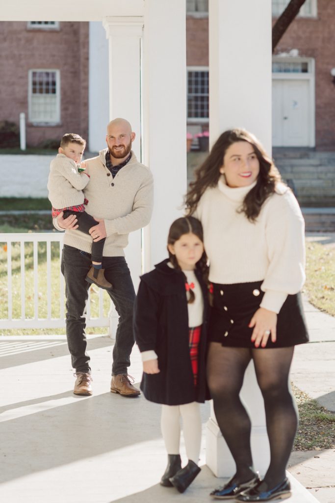 Brooke reached out to me for holiday family session and she had plans, props and we were all looking forward to Brooke and Mike’s holiday family session with their two kids Grace and Tommy at Historic Richmond Town in Staten Island NY. Brooke and Mike are from Staten Island and they did not live too far from Historic Richmond Town and they decorate the whole town pretty festive so we decide to meet there. But like all plans Brooke’s big hope for her very first professional photoshoot didn’t go as she planed. Her two kids Grace and Tommy were not having it. As soon as they got to the parking lot Tommy fell asleep. Grace was shy and scared to have her photos taken by a stranger photographer me. But we tried and got some good cute photos, and some not so cute and grumpy photos as well. Brooke, Mike, Grace and Tommy’s Historic Richmond Town Staten Island Holiday Family session documented and photographed by Karis from Hey Karis. Photograph is like freezing time, motion in print, movie turned into a book. Now booking 2021 and 2022 weddings.