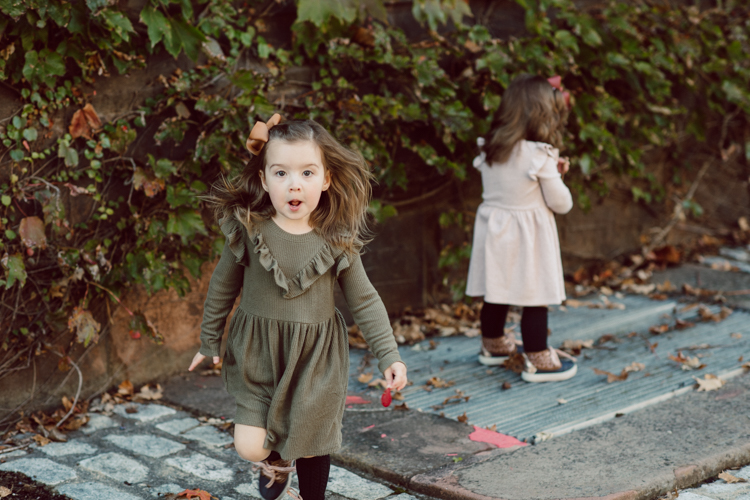 Weather was so amazing on the day I met Kristen and Anthony for their family session with three of their adorable daughters. Clare and Cass are the older two girls and from the moment I met them they showed me their fun personalities, l laughed, smiled and ran around Princeton University campus. I had such a fun time with the adorable D’Elia family. Kristen and Anthony D’Elia Fall Family Session in Princeton University campus photographed by Karis from Hey Karis. Photograph is like freezing time, motion in print, movie turned into a book.