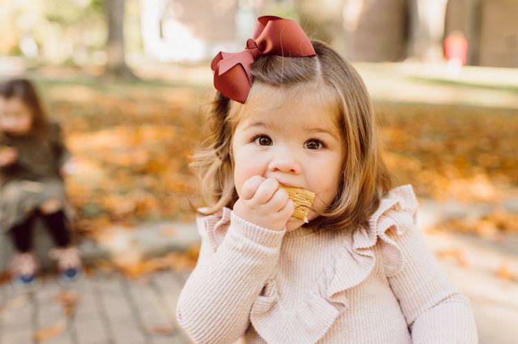 Weather was so amazing on the day I met Kristen and Anthony for their family session with three of their adorable daughters. Clare and Cass are the older two girls and from the moment I met them they showed me their fun personalities, l laughed, smiled and ran around Princeton University campus. I had such a fun time with the adorable D’Elia family. Kristen and Anthony D’Elia Fall Family Session in Princeton University campus photographed by Karis from Hey Karis. Photograph is like freezing time, motion in print, movie turned into a book.