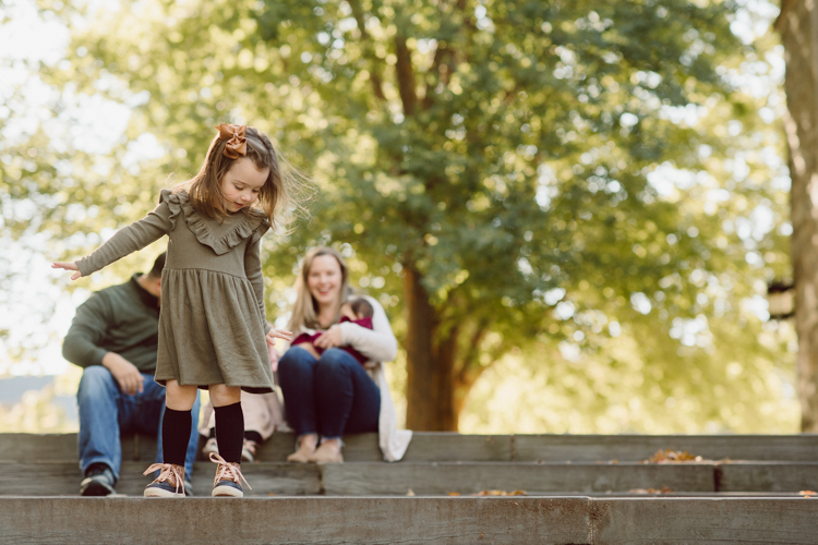 Weather was so amazing on the day I met Kristen and Anthony for their family session with three of their adorable daughters. Clare and Cass are the older two girls and from the moment I met them they showed me their fun personalities, l laughed, smiled and ran around Princeton University campus. I had such a fun time with the adorable D’Elia family. Kristen and Anthony D’Elia Fall Family Session in Princeton University campus photographed by Karis from Hey Karis. Photograph is like freezing time, motion in print, movie turned into a book.