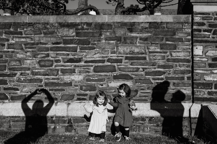 Weather was so amazing on the day I met Kristen and Anthony for their family session with three of their adorable daughters. Clare and Cass are the older two girls and from the moment I met them they showed me their fun personalities, l laughed, smiled and ran around Princeton University campus. I had such a fun time with the adorable D’Elia family. Kristen and Anthony D’Elia Fall Family Session in Princeton University campus photographed by Karis from Hey Karis. Photograph is like freezing time, motion in print, movie turned into a book.