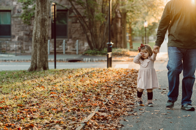 Weather was so amazing on the day I met Kristen and Anthony for their family session with three of their adorable daughters. Clare and Cass are the older two girls and from the moment I met them they showed me their fun personalities, l laughed, smiled and ran around Princeton University campus. I had such a fun time with the adorable D’Elia family. Kristen and Anthony D’Elia Fall Family Session in Princeton University campus photographed by Karis from Hey Karis. Photograph is like freezing time, motion in print, movie turned into a book.