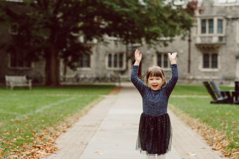 Windy morning spent at Princeton University Campus with Melissa, Joe, Everly and Cecilia. Everyone was bit cold and new to this family session but soon after how much fun and silly we can be during the photo session Everly warmed up, took her jacker off and ran. She ran, fell, hopped and would not stop posing for me. Till the moment we were ready to go home Everly posed, asked me to take more photos of her. Such a fun time with Bowen family during their family session at Princeton NJ photographed by Karis from Hey Karis. Photograph is like freezing time, motion in print, movie turned into a book. Now booking 2021 and 2022 weddings.