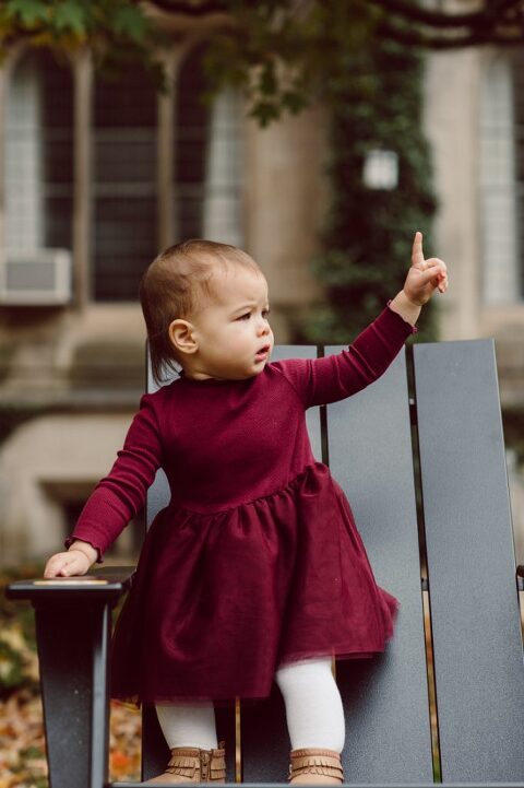 Windy morning spent at Princeton University Campus with Melissa, Joe, Everly and Cecilia. Everyone was bit cold and new to this family session but soon after how much fun and silly we can be during the photo session Everly warmed up, took her jacker off and ran. She ran, fell, hopped and would not stop posing for me. Till the moment we were ready to go home Everly posed, asked me to take more photos of her. Such a fun time with Bowen family during their family session at Princeton NJ photographed by Karis from Hey Karis. Photograph is like freezing time, motion in print, movie turned into a book. Now booking 2021 and 2022 weddings.