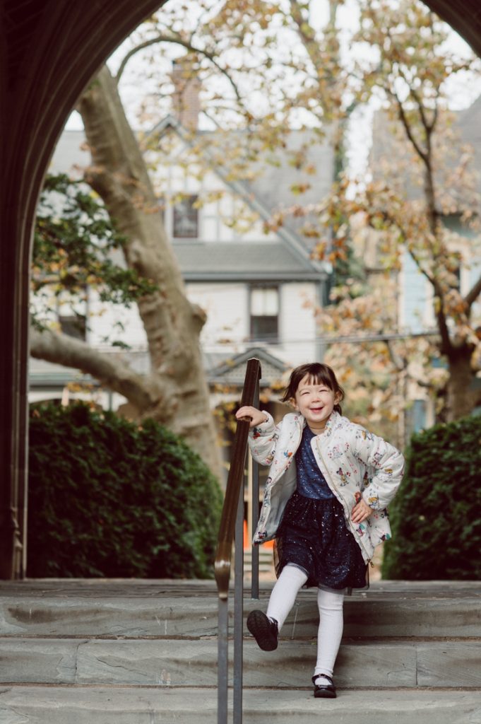Windy morning spent at Princeton University Campus with Melissa, Joe, Everly and Cecilia. Everyone was bit cold and new to this family session but soon after how much fun and silly we can be during the photo session Everly warmed up, took her jacker off and ran. She ran, fell, hopped and would not stop posing for me. Till the moment we were ready to go home Everly posed, asked me to take more photos of her. Such a fun time with Bowen family during their family session at Princeton NJ photographed by Karis from Hey Karis. Photograph is like freezing time, motion in print, movie turned into a book. Now booking 2021 and 2022 weddings.