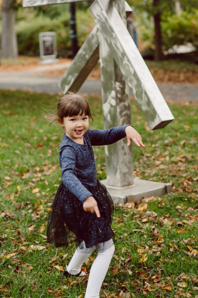 Windy morning spent at Princeton University Campus with Melissa, Joe, Everly and Cecilia. Everyone was bit cold and new to this family session but soon after how much fun and silly we can be during the photo session Everly warmed up, took her jacker off and ran. She ran, fell, hopped and would not stop posing for me. Till the moment we were ready to go home Everly posed, asked me to take more photos of her. Such a fun time with Bowen family during their family session at Princeton NJ photographed by Karis from Hey Karis. Photograph is like freezing time, motion in print, movie turned into a book. Now booking 2021 and 2022 weddings.