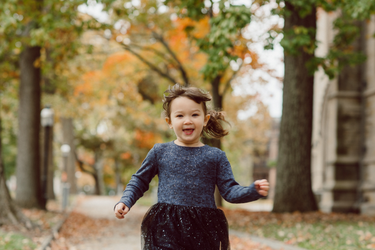 Windy morning spent at Princeton University Campus with Melissa, Joe, Everly and Cecilia. Everyone was bit cold and new to this family session but soon after how much fun and silly we can be during the photo session Everly warmed up, took her jacker off and ran. She ran, fell, hopped and would not stop posing for me. Till the moment we were ready to go home Everly posed, asked me to take more photos of her. Such a fun time with Bowen family during their family session at Princeton NJ photographed by Karis from Hey Karis. Photograph is like freezing time, motion in print, movie turned into a book. Now booking 2021 and 2022 weddings.