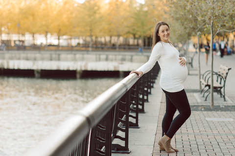 Very hot & sunny afternoon in November I met with Sam and Nick for the maternity session. This expecting parents brought their two fur babies out with them in the hopes of getting some photos of just four before the baby comes next months. Their puppies Cats and Cabo are shih-poos (shih Tzu and Toy Poodle mix) and are too adorable. With Case, Cabo walking along their parents sides we walked along the waterfront of Hoboken NJ. Sam was literally glowing like a porcelain doll and Nick looked so excited and a bit nervous for boy’s arrival. Sam and Nick’s maternity/family session in Hoboken NJ photographed by Karis from Hey Karis. Photograph is like freezing time, motion in print, movie turned into a book. Now booking 2021 and 2022 weddings.