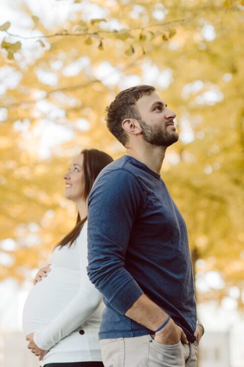 Very hot & sunny afternoon in November I met with Sam and Nick for the maternity session. This expecting parents brought their two fur babies out with them in the hopes of getting some photos of just four before the baby comes next months. Their puppies Cats and Cabo are shih-poos (shih Tzu and Toy Poodle mix) and are too adorable. With Case, Cabo walking along their parents sides we walked along the waterfront of Hoboken NJ. Sam was literally glowing like a porcelain doll and Nick looked so excited and a bit nervous for boy’s arrival. Sam and Nick’s maternity/family session in Hoboken NJ photographed by Karis from Hey Karis. Photograph is like freezing time, motion in print, movie turned into a book. Now booking 2021 and 2022 weddings.