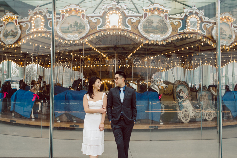 DUMBO Brooklyn NY photographing Stella and Peter's engagement. Temperature dropped dramatically, sky was covered in cloud and was windy but you can't possibly tell by Stella's chic outfit, white strap dress with white kitten heel mules and Peter in his suit and a Gucci tie. Per their outfits, my concept for Stella and Peter's engagement session geared to more editorial. As I shoot I tried to imagine a story in which I want to create and tell through my photos in every session. Stella and Peter's DUMBO Brooklyn Engagement Session captured by NY NJ Documentary Wedding Photographer Karis from Hey Karis, photographing your wedding moments cinematically.