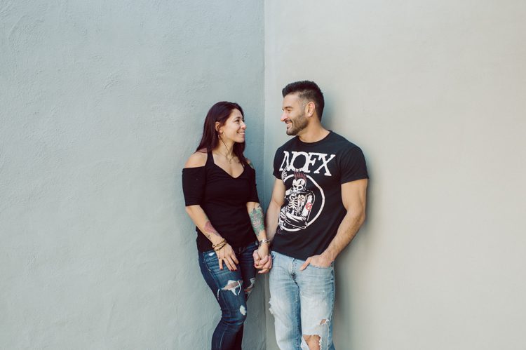 When Cristina and Nick mentioned that they want to do a day in the life, lifestyle type of engagement session at comfort of their home I was all in. What other places on earth other than your home describes you the most! You are most comfortable in your own home, and it shows in these engagement photos of Cristina and Nick that they were cozy. I sensed that Cristina and Nick were both bit shy, quiet, introverts so doing their engagement session at their home made it easier for them to open up and warm up to me. They showed me around their house, telling me stories about the electric guitars on the wall, plants, Nick's mom's snowman collections and into the basement where I saw Nick's Marvel and Super Hero collections. We took photos in all their familiar spaces around the house then out back by the fire pit where Nick had already started the fire before I came. Cristina and Nick told me that's where they love to hang out the most, fire pit with drinks in their hands, cozying up with a blanket over them. Funny story, Cristina and Nick's first date was at the house because they met in the beginning of COVID lockdown and had no where to go so Nick lite the fire pit and they had their romantic fire pit first date. And rest is history! So their engagement session at home in Wayne just made sense. Before the session was over we had to take one last photo with super hero helmet! of course Nick picks Iron Man and Cristina got stuck w Ant Man. I loved Cristina and Nick's calm vibe and getting to know them through my lens during their home engagement session captured by NY NJ Documentary Wedding Photographer Karis from Hey Karis, photographing your wedding, capturing your love and documenting your life.