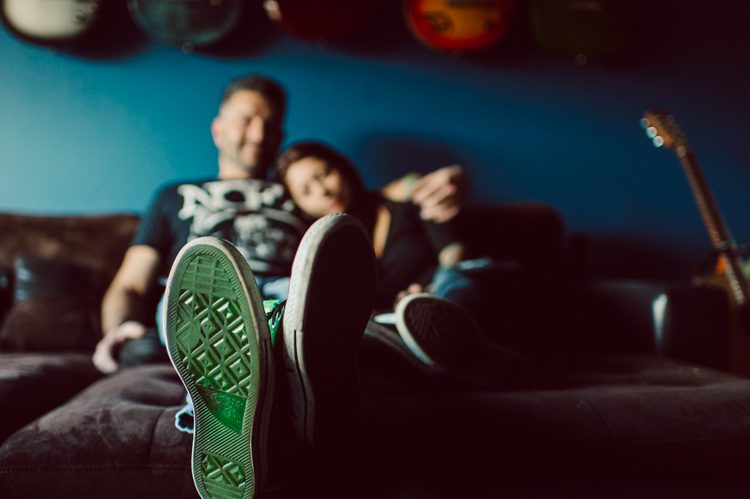 When Cristina and Nick mentioned that they want to do a day in the life, lifestyle type of engagement session at comfort of their home I was all in. What other places on earth other than your home describes you the most! You are most comfortable in your own home, and it shows in these engagement photos of Cristina and Nick that they were cozy. I sensed that Cristina and Nick were both bit shy, quiet, introverts so doing their engagement session at their home made it easier for them to open up and warm up to me. They showed me around their house, telling me stories about the electric guitars on the wall, plants, Nick's mom's snowman collections and into the basement where I saw Nick's Marvel and Super Hero collections. We took photos in all their familiar spaces around the house then out back by the fire pit where Nick had already started the fire before I came. Cristina and Nick told me that's where they love to hang out the most, fire pit with drinks in their hands, cozying up with a blanket over them. Funny story, Cristina and Nick's first date was at the house because they met in the beginning of COVID lockdown and had no where to go so Nick lite the fire pit and they had their romantic fire pit first date. And rest is history! So their engagement session at home in Wayne just made sense. Before the session was over we had to take one last photo with super hero helmet! of course Nick picks Iron Man and Cristina got stuck w Ant Man. I loved Cristina and Nick's calm vibe and getting to know them through my lens during their home engagement session captured by NY NJ Documentary Wedding Photographer Karis from Hey Karis, photographing your wedding, capturing your love and documenting your life.