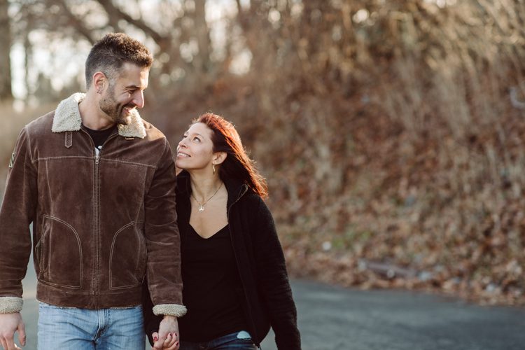 When Cristina and Nick mentioned that they want to do a day in the life, lifestyle type of engagement session at comfort of their home I was all in. What other places on earth other than your home describes you the most! You are most comfortable in your own home, and it shows in these engagement photos of Cristina and Nick that they were cozy. I sensed that Cristina and Nick were both bit shy, quiet, introverts so doing their engagement session at their home made it easier for them to open up and warm up to me. They showed me around their house, telling me stories about the electric guitars on the wall, plants, Nick's mom's snowman collections and into the basement where I saw Nick's Marvel and Super Hero collections. We took photos in all their familiar spaces around the house then out back by the fire pit where Nick had already started the fire before I came. Cristina and Nick told me that's where they love to hang out the most, fire pit with drinks in their hands, cozying up with a blanket over them. Funny story, Cristina and Nick's first date was at the house because they met in the beginning of COVID lockdown and had no where to go so Nick lite the fire pit and they had their romantic fire pit first date. And rest is history! So their engagement session at home in Wayne just made sense. Before the session was over we had to take one last photo with super hero helmet! of course Nick picks Iron Man and Cristina got stuck w Ant Man. I loved Cristina and Nick's calm vibe and getting to know them through my lens during their home engagement session captured by NY NJ Documentary Wedding Photographer Karis from Hey Karis, photographing your wedding, capturing your love and documenting your life.