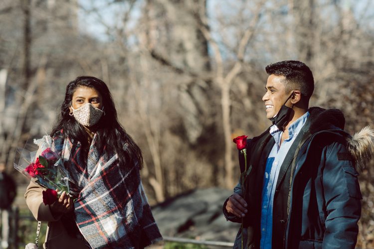 Nisha and Sagar's Ladies Pavilion Central Park NY proposal on a sunny sunday afternoon went just as Sagar planned it to be and more with their friends to celebrate together. Nisha and Sagar walked from their NYC apartment to Ladies Pavilion Central Park pretending to meet their friends for a pop up lunch but as soon as Nisha saw all her girlfriends standing by Ladies Pavilion holding roses, she quickly figured out what was about to happen. Then Sagar walked Nisha over into Ladies Pavilion where it was decorated with candles and rose pedals, Sagar went down on his one knee pulled out the ring. Watching Sagar go on his knee Nisha also went on her knee and received her ring while saying "Yes" and hugging him. All the emotions, tears hanging off her big round eyes. I truly felt so honored to be able to capture this special moment in their lives for them, documenting the beginning of their next chapter in life. Nisha and Sagar's Ladies Pavilion Central Park proposal captured by NY NJ Documentary Wedding Photographer Karis from Hey Karis, photographing your wedding, capturing your love and documenting your life.