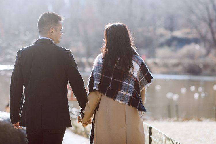 Nisha and Sagar's Ladies Pavilion Central Park NY proposal on a sunny sunday afternoon went just as Sagar planned it to be and more with their friends to celebrate together. Nisha and Sagar walked from their NYC apartment to Ladies Pavilion Central Park pretending to meet their friends for a pop up lunch but as soon as Nisha saw all her girlfriends standing by Ladies Pavilion holding roses, she quickly figured out what was about to happen. Then Sagar walked Nisha over into Ladies Pavilion where it was decorated with candles and rose pedals, Sagar went down on his one knee pulled out the ring. Watching Sagar go on his knee Nisha also went on her knee and received her ring while saying "Yes" and hugging him. All the emotions, tears hanging off her big round eyes. I truly felt so honored to be able to capture this special moment in their lives for them, documenting the beginning of their next chapter in life. Nisha and Sagar's Ladies Pavilion Central Park proposal captured by NY NJ Documentary Wedding Photographer Karis from Hey Karis, photographing your wedding, capturing your love and documenting your life.