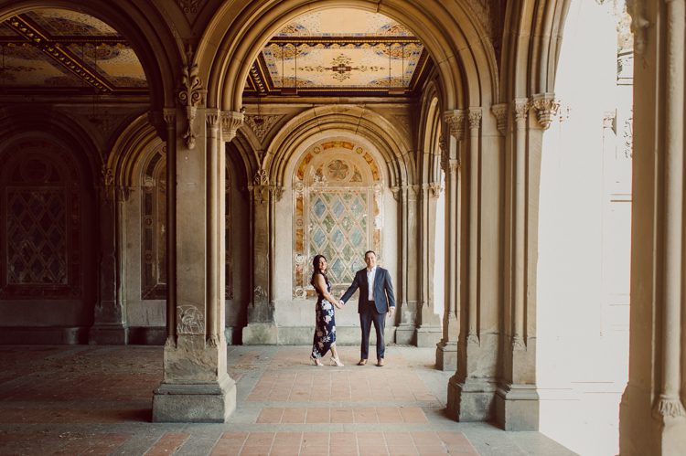 Bethesda Terrace Arcade in Central Park NY in my opinion alway so lovely. I saw Brianna and Joe standing in the middle of Bethesda Terrace next to the fountain. We walked right into the crowd of Central Park and started our engagement session. Cherry Blossoms were still in bloom along with all the spring blooms. Spring sun was brilliant and smiles on Brianna and Joe during the engagement session was so beautiful. Brianna and Joe's Bethesda Terrace Arcade in Central Park NY engagement session captured by NY NJ Weddings, Elopements and Family Photographer Karis.