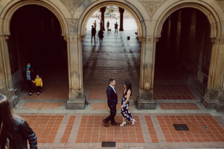 Bethesda Terrace Arcade in Central Park NY in my opinion alway so lovely. I saw Brianna and Joe standing in the middle of Bethesda Terrace next to the fountain. We walked right into the crowd of Central Park and started our engagement session. Cherry Blossoms were still in bloom along with all the spring blooms. Spring sun was brilliant and smiles on Brianna and Joe during the engagement session was so beautiful. Brianna and Joe's Bethesda Terrace Arcade in Central Park NY engagement session captured by NY NJ Weddings, Elopements and Family Photographer Karis.