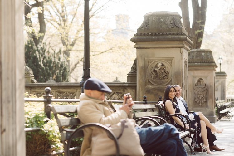 Bethesda Terrace Arcade in Central Park NY in my opinion alway so lovely. I saw Brianna and Joe standing in the middle of Bethesda Terrace next to the fountain. We walked right into the crowd of Central Park and started our engagement session. Cherry Blossoms were still in bloom along with all the spring blooms. Spring sun was brilliant and smiles on Brianna and Joe during the engagement session was so beautiful. Brianna and Joe's Bethesda Terrace Arcade in Central Park NY engagement session captured by NY NJ Weddings, Elopements and Family Photographer Karis.