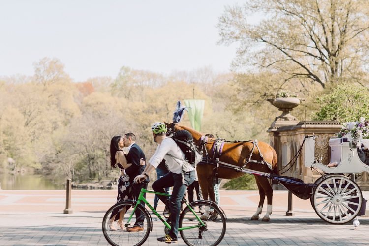 Bethesda Terrace Arcade in Central Park NY in my opinion alway so lovely. I saw Brianna and Joe standing in the middle of Bethesda Terrace next to the fountain. We walked right into the crowd of Central Park and started our engagement session. Cherry Blossoms were still in bloom along with all the spring blooms. Spring sun was brilliant and smiles on Brianna and Joe during the engagement session was so beautiful. Brianna and Joe's Bethesda Terrace Arcade in Central Park NY engagement session captured by NY NJ Weddings, Elopements and Family Photographer Karis.