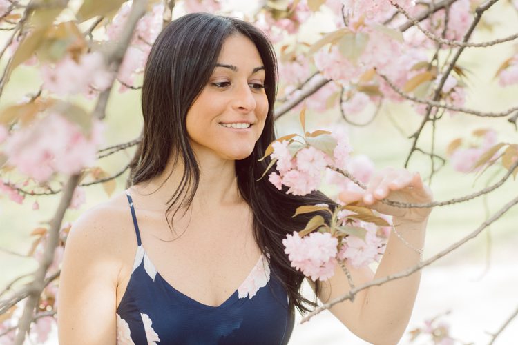 Bethesda Terrace Arcade in Central Park NY in my opinion alway so lovely. I saw Brianna and Joe standing in the middle of Bethesda Terrace next to the fountain. We walked right into the crowd of Central Park and started our engagement session. Cherry Blossoms were still in bloom along with all the spring blooms. Spring sun was brilliant and smiles on Brianna and Joe during the engagement session was so beautiful. Brianna and Joe's Bethesda Terrace Arcade in Central Park NY engagement session captured by NY NJ Weddings, Elopements and Family Photographer Karis.