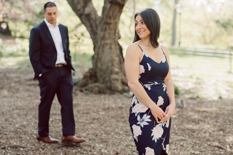 Bethesda Terrace Arcade in Central Park NY in my opinion alway so lovely. I saw Brianna and Joe standing in the middle of Bethesda Terrace next to the fountain. We walked right into the crowd of Central Park and started our engagement session. Cherry Blossoms were still in bloom along with all the spring blooms. Spring sun was brilliant and smiles on Brianna and Joe during the engagement session was so beautiful. Brianna and Joe's Bethesda Terrace Arcade in Central Park NY engagement session captured by NY NJ Weddings, Elopements and Family Photographer Karis.