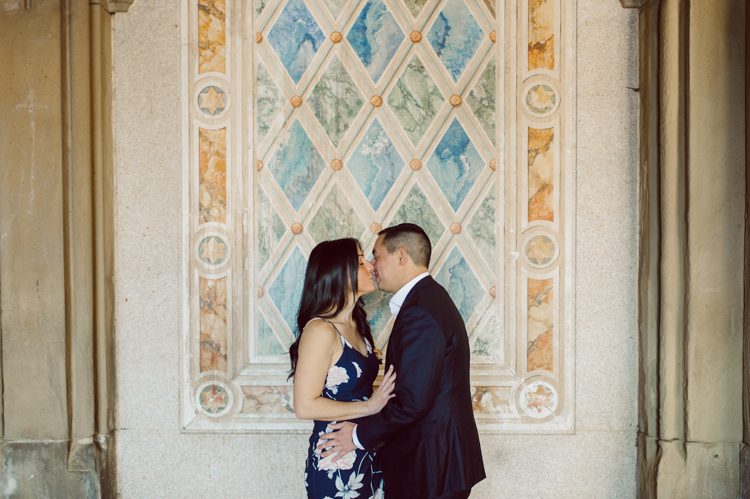 Bethesda Terrace Arcade in Central Park NY in my opinion alway so lovely. I saw Brianna and Joe standing in the middle of Bethesda Terrace next to the fountain. We walked right into the crowd of Central Park and started our engagement session. Cherry Blossoms were still in bloom along with all the spring blooms. Spring sun was brilliant and smiles on Brianna and Joe during the engagement session was so beautiful. Brianna and Joe's Bethesda Terrace Arcade in Central Park NY engagement session captured by NY NJ Weddings, Elopements and Family Photographer Karis.