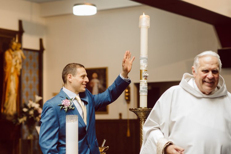 Colleen and Patrick had an intimate wedding ceremony at their church in Queens, NY then we went over to Gantry Plaza State Park LIC for their wedding photos. Colleen and Patrick's NYC elopement was nothing but fabulous and spectacle. When I saw all the food trucks lined up along Gantry Plaza State Park I knew I wanted to use it as our backdrop for Colleen and Patrick. Of course we chose "Mr Softee's Ice Truck" and as we were taking the photo one of Colleen and Patrick's cousin walked by doing the most epic photobomb ever! Colleen and Patrick's NYC elopement Gantry Plaza State Park LIC captured by NY NJ Weddings, Elopements and Family Photographer Karis by Hey Karis.