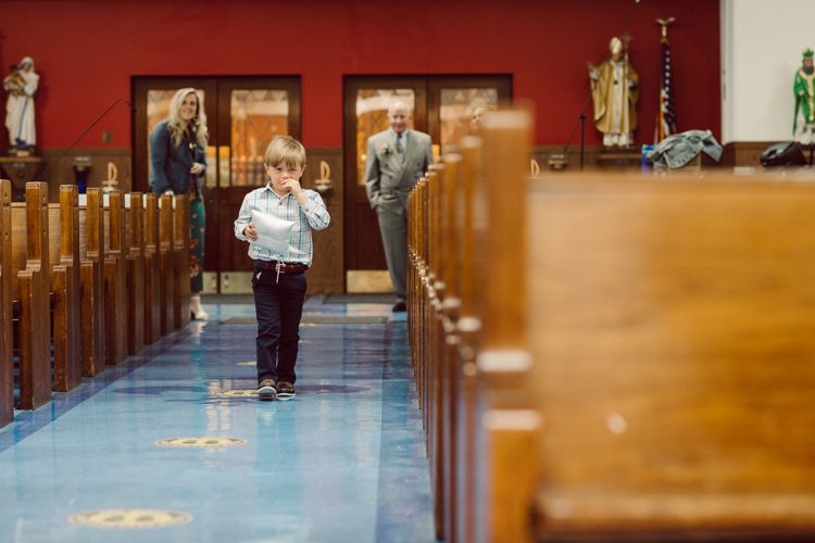 Colleen and Patrick had an intimate wedding ceremony at their church in Queens, NY then we went over to Gantry Plaza State Park LIC for their wedding photos. Colleen and Patrick's NYC elopement was nothing but fabulous and spectacle. When I saw all the food trucks lined up along Gantry Plaza State Park I knew I wanted to use it as our backdrop for Colleen and Patrick. Of course we chose "Mr Softee's Ice Truck" and as we were taking the photo one of Colleen and Patrick's cousin walked by doing the most epic photobomb ever! Colleen and Patrick's NYC elopement Gantry Plaza State Park LIC captured by NY NJ Weddings, Elopements and Family Photographer Karis by Hey Karis.