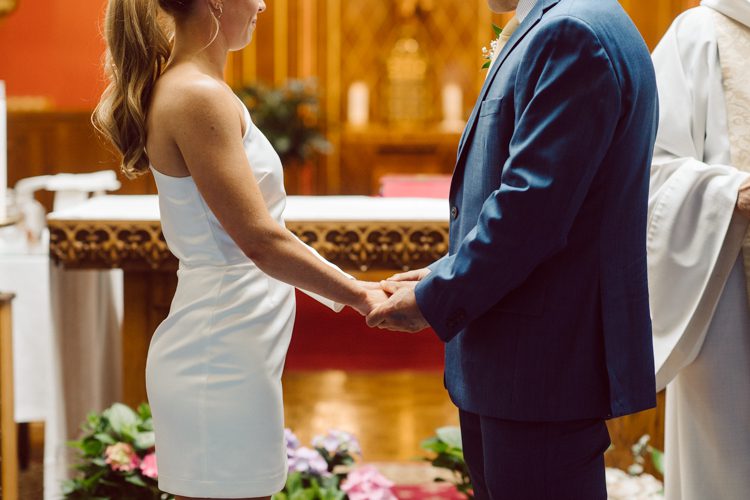 Colleen and Patrick had an intimate wedding ceremony at their church in Queens, NY then we went over to Gantry Plaza State Park LIC for their wedding photos. Colleen and Patrick's NYC elopement was nothing but fabulous and spectacle. When I saw all the food trucks lined up along Gantry Plaza State Park I knew I wanted to use it as our backdrop for Colleen and Patrick. Of course we chose "Mr Softee's Ice Truck" and as we were taking the photo one of Colleen and Patrick's cousin walked by doing the most epic photobomb ever! Colleen and Patrick's NYC elopement Gantry Plaza State Park LIC captured by NY NJ Weddings, Elopements and Family Photographer Karis by Hey Karis.