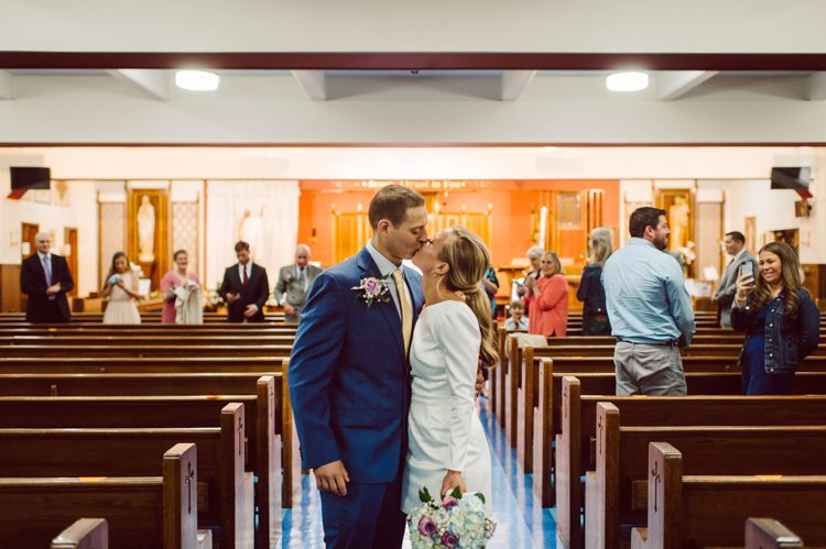 Colleen and Patrick had an intimate wedding ceremony at their church in Queens, NY then we went over to Gantry Plaza State Park LIC for their wedding photos. Colleen and Patrick's NYC elopement was nothing but fabulous and spectacle. When I saw all the food trucks lined up along Gantry Plaza State Park I knew I wanted to use it as our backdrop for Colleen and Patrick. Of course we chose "Mr Softee's Ice Truck" and as we were taking the photo one of Colleen and Patrick's cousin walked by doing the most epic photobomb ever! Colleen and Patrick's NYC elopement Gantry Plaza State Park LIC captured by NY NJ Weddings, Elopements and Family Photographer Karis by Hey Karis.