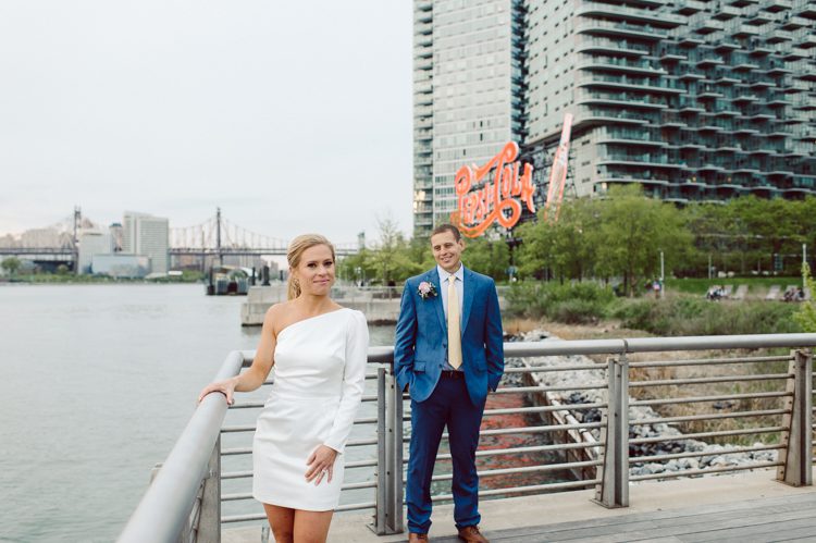 Colleen and Patrick had an intimate wedding ceremony at their church in Queens, NY then we went over to Gantry Plaza State Park LIC for their wedding photos. Colleen and Patrick's NYC elopement was nothing but fabulous and spectacle. When I saw all the food trucks lined up along Gantry Plaza State Park I knew I wanted to use it as our backdrop for Colleen and Patrick. Of course we chose "Mr Softee's Ice Truck" and as we were taking the photo one of Colleen and Patrick's cousin walked by doing the most epic photobomb ever! Colleen and Patrick's NYC elopement Gantry Plaza State Park LIC captured by NY NJ Weddings, Elopements and Family Photographer Karis by Hey Karis.
