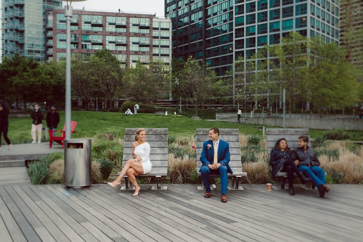 Colleen and Patrick had an intimate wedding ceremony at their church in Queens, NY then we went over to Gantry Plaza State Park LIC for their wedding photos. Colleen and Patrick's NYC elopement was nothing but fabulous and spectacle. When I saw all the food trucks lined up along Gantry Plaza State Park I knew I wanted to use it as our backdrop for Colleen and Patrick. Of course we chose "Mr Softee's Ice Truck" and as we were taking the photo one of Colleen and Patrick's cousin walked by doing the most epic photobomb ever! Colleen and Patrick's NYC elopement Gantry Plaza State Park LIC captured by NY NJ Weddings, Elopements and Family Photographer Karis by Hey Karis.