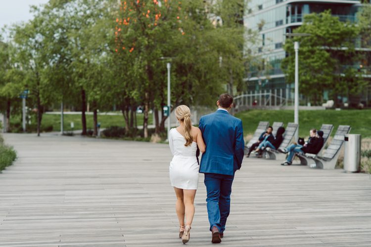 Colleen and Patrick had an intimate wedding ceremony at their church in Queens, NY then we went over to Gantry Plaza State Park LIC for their wedding photos. Colleen and Patrick's NYC elopement was nothing but fabulous and spectacle. When I saw all the food trucks lined up along Gantry Plaza State Park I knew I wanted to use it as our backdrop for Colleen and Patrick. Of course we chose "Mr Softee's Ice Truck" and as we were taking the photo one of Colleen and Patrick's cousin walked by doing the most epic photobomb ever! Colleen and Patrick's NYC elopement Gantry Plaza State Park LIC captured by NY NJ Weddings, Elopements and Family Photographer Karis by Hey Karis.