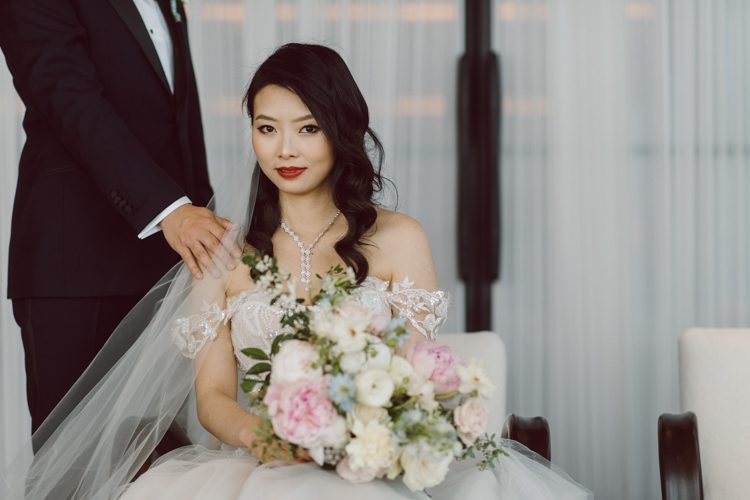 Public Hotel NYC spring rooftop wedding with Stella and Peter. NYC began to loosen COVID restrictions so events and weddings were finally allowed. Stella and Peter were able to keep their original wedding date, but unfortunately Stella's parents couldn't make it to the wedding due to COVID travel restrictions. Stella and Peter's wedding took place on 17th floor with rooftop access at the Public Hotel. Their wedding ceremony was on the rooftop, as well as their first look and some photos then we wandered around the hotel and took some epic photos at the pent house and escalator. Public Hotel NYC was so fun to photograph and I had the coolest, the most chill couple to work with. Stella and Peter's epic wedding at Public Hotel NYC photographed by Karis | Hey Karis.