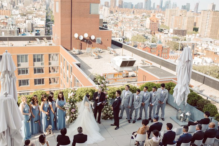 Public Hotel NYC spring rooftop wedding with Stella and Peter. NYC began to loosen COVID restrictions so events and weddings were finally allowed. Stella and Peter were able to keep their original wedding date, but unfortunately Stella's parents couldn't make it to the wedding due to COVID travel restrictions. Stella and Peter's wedding took place on 17th floor with rooftop access at the Public Hotel. Their wedding ceremony was on the rooftop, as well as their first look and some photos then we wandered around the hotel and took some epic photos at the pent house and escalator. Public Hotel NYC was so fun to photograph and I had the coolest, the most chill couple to work with. Stella and Peter's epic wedding at Public Hotel NYC photographed by Karis | Hey Karis.
