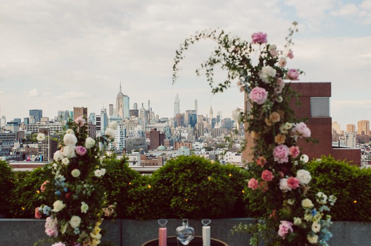 Public Hotel NYC spring rooftop wedding with Stella and Peter. NYC began to loosen COVID restrictions so events and weddings were finally allowed. Stella and Peter were able to keep their original wedding date, but unfortunately Stella's parents couldn't make it to the wedding due to COVID travel restrictions. Stella and Peter's wedding took place on 17th floor with rooftop access at the Public Hotel. Their wedding ceremony was on the rooftop, as well as their first look and some photos then we wandered around the hotel and took some epic photos at the pent house and escalator. Public Hotel NYC was so fun to photograph and I had the coolest, the most chill couple to work with. Stella and Peter's epic wedding at Public Hotel NYC photographed by Karis | Hey Karis.