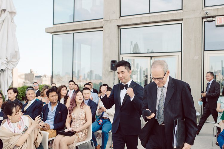 Public Hotel NYC spring rooftop wedding with Stella and Peter. NYC began to loosen COVID restrictions so events and weddings were finally allowed. Stella and Peter were able to keep their original wedding date, but unfortunately Stella's parents couldn't make it to the wedding due to COVID travel restrictions. Stella and Peter's wedding took place on 17th floor with rooftop access at the Public Hotel. Their wedding ceremony was on the rooftop, as well as their first look and some photos then we wandered around the hotel and took some epic photos at the pent house and escalator. Public Hotel NYC was so fun to photograph and I had the coolest, the most chill couple to work with. Stella and Peter's epic wedding at Public Hotel NYC photographed by Karis | Hey Karis.