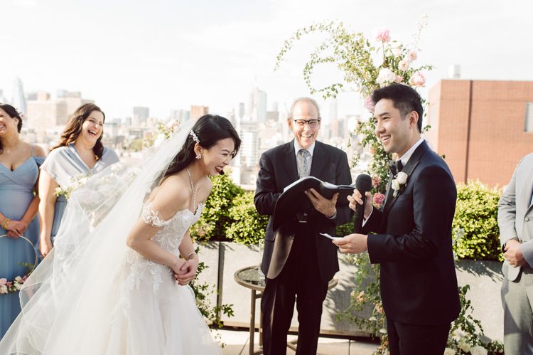 Public Hotel NYC spring rooftop wedding with Stella and Peter. NYC began to loosen COVID restrictions so events and weddings were finally allowed. Stella and Peter were able to keep their original wedding date, but unfortunately Stella's parents couldn't make it to the wedding due to COVID travel restrictions. Stella and Peter's wedding took place on 17th floor with rooftop access at the Public Hotel. Their wedding ceremony was on the rooftop, as well as their first look and some photos then we wandered around the hotel and took some epic photos at the pent house and escalator. Public Hotel NYC was so fun to photograph and I had the coolest, the most chill couple to work with. Stella and Peter's epic wedding at Public Hotel NYC photographed by Karis | Hey Karis.