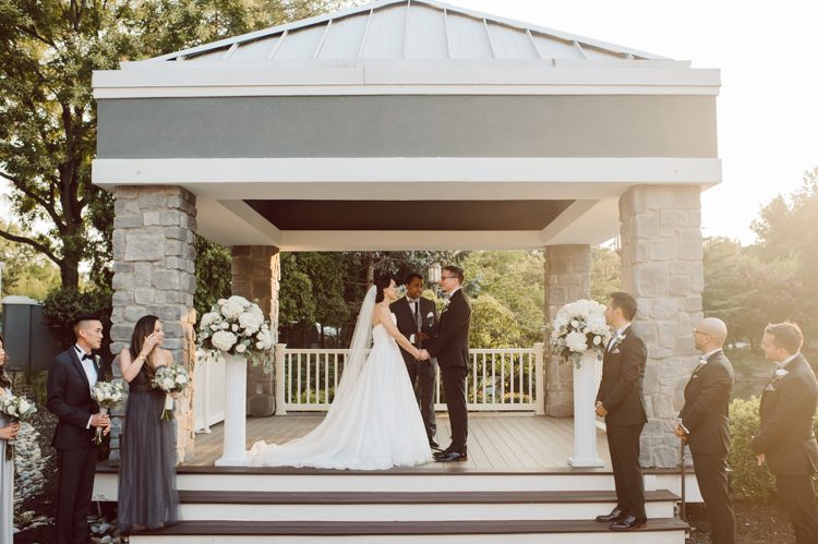 Two smart, corky and bubbly couple Christina and GP tied the knot at Bridgewater Manor. This doctor duo's very first priority while planning for their wedding was to create a safe wedding day for everyone. This "White Castle Burger" loving groom GP and sweet sweet Christina's wedding day was as I expected fun fun and fun. Their wedding day went smoothly, pleasantly and flawlessly. The whole day flew by because we were all having too much fun, I hope you'll relive the perfect moment through these photos.   NY NJ wedding and elopement photographer Karis, Hey Karis photographing Christina and GP's wedding at Bridgewater Manor, NJ. Christina and GP got ready at Hyatt House Bridgewater NJ, first look and wedding portraits took place at Leonard J Buck Gardens in the late afternoon. Christina and GP's outdoor wedding ceremony was right on time during gorgeous sunset at Bridgewater Manor. This beautiful smart doctor couple tied the knot with the most perfect sunset in front of their friends and family. These two then celebrated and partied the night away with smiles and dancing shoes. Bridgewater Manor NJ wedding photographed by Karis, NY NJ wedding and elopement photographer Hey Karis.