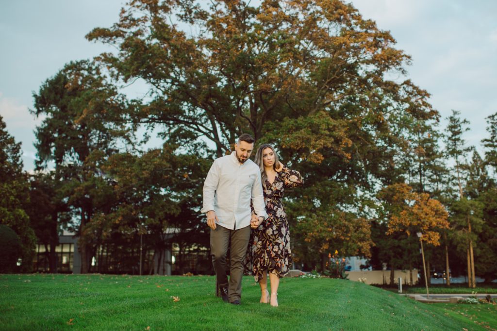 Samantha and Mike met while attending Monmouth University in West Long Branch, NJ. Sam and Mike's relationship wasn't a romantic one in the beginning but slowly they felt love for each other and one perfect day they became a couple. For their Fall engagement session, Sam and Mike decided to visit their old campus for their engagement session where it all began for them. Sam and Mike's Monmouth University Engagement photographed by NYC elopement, Hudson Valley, Catskills, NY and NJ, Farm, Adventure Wedding and Elopement Photographer Karis | Hey Karis