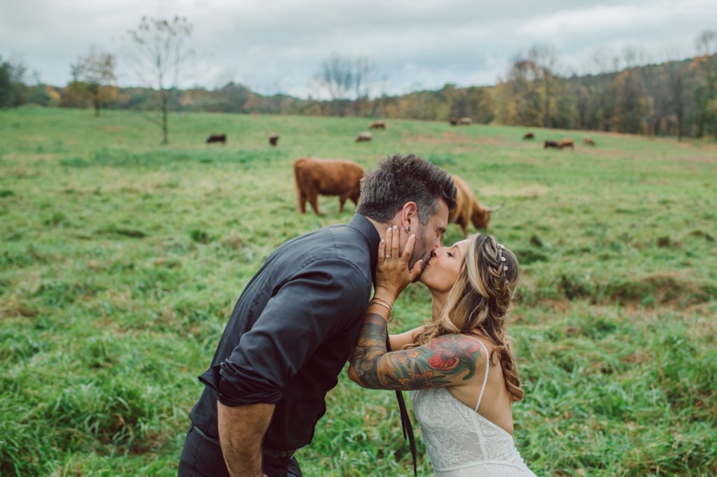 The Farm at Glenwood Mountain located in Sussex, NJ right by Mountain Creek Resort, this unique farm wedding venue was on my bucket list and I had the chance to photograph a wedding here with the best couple! Cristina and Nick, rock'n roll loving die hard fan of Marvel Studio duo celebrated their love and becoming one union at The Farm at Glenwood Mountain with fluffy cows in their backdrop. Cristina and Nick's love for each other is so real and true brought tears and smile on my eye and face the entire day. Cristina and Nick's The Farm and Glenwood Mountain wedding photographed by Hudson Valley, Catskills, NYC and NJ, Fun Wedding and Intimate Elopement Photographer | Hey Karis.